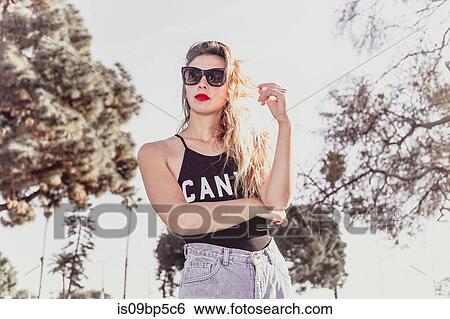 Hip young woman in park View Large Photo Image Stock Photograph - Hip young woman in park. Fotosearch