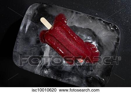 Homemade raspberry iced lolly melting on block of ice, overhead view View Large Photo Image Stock Image - Homemade raspberry iced lolly melting on block of ice, overhead view. Fotosearch