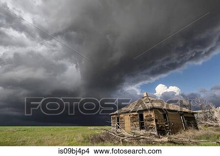 Intense sunshine and severe thunderstorm, barn in foreground, Cope, Colorado, US View Large Photo Image Picture - Intense sunshine and severe thunderstorm, barn in foreground, Cope, Colorado, US. Fotosearch