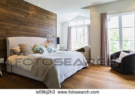 King size bed in bedroom with hickory wood floorboards View Large Photo Image Stock Image - King size bed in bedroom with hickory wood floorboards. Fotosearch