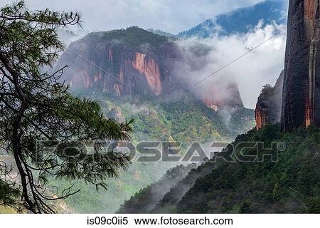 Landscape with low cloud over Thousand Turtle mountain, elevated view, Lijiang, Hunan Province, China View Large Photo Image Stock Photography - Landscape with low cloud over Thousand Turtle mountain, elevated view, Lijiang, Hunan Province, China. Fotosearch