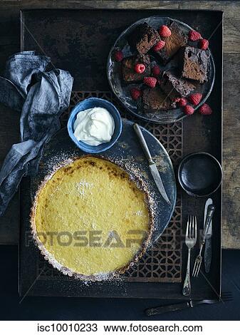 Lemon curd tart and brownies View Large Photo Image Stock Image - Lemon curd tart and brownies. Fotosearch