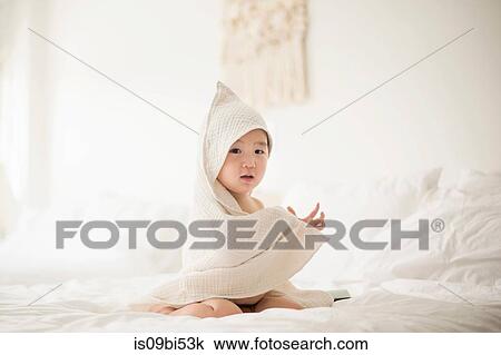 Little boy with hooded towel in bed View Large Photo Image Stock Image - Little boy with hooded towel in bed. Fotosearch