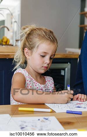 Little girl colouring picture at home View Large Photo Image Stock Photograph - Little girl colouring picture at home. Fotosearch