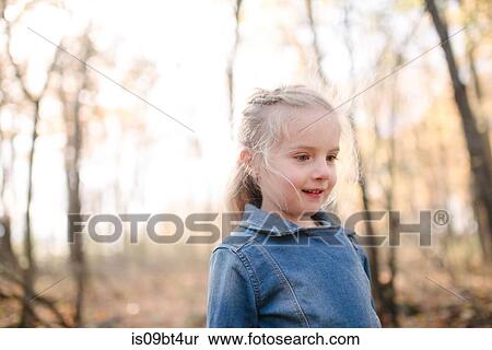 Stock Photography - Little girl exploring forest. Fotosearch