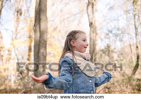 Little girl holding out hands in forest View Large Photo Image Stock Photography - Little girl holding out hands in forest. Fotosearch