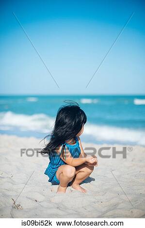 Little girl on beach View Large Photo Image Stock Image - Little girl on beach. Fotosearch