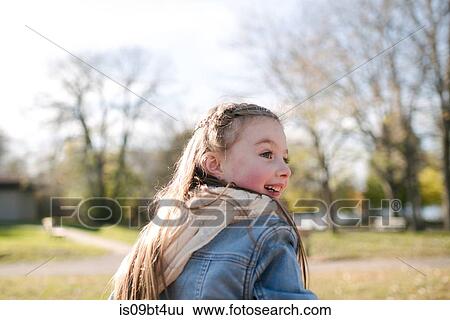 Little girl playing in park View Large Photo Image Stock Photograph - Little girl playing in park. Fotosearch