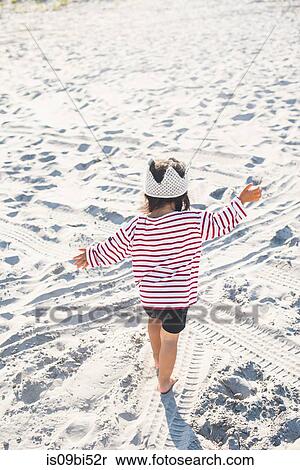 Little girl playing on beach View Large Photo Image Stock Photography - Little girl playing on beach. Fotosearch