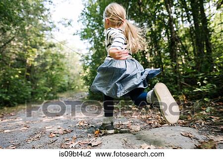Little girl running in forest View Large Photo Image Stock Image - Little girl running in forest. Fotosearch