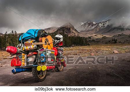 Loaded touring motorcycle on roadside with dramatic sky over Mount Shasta, California, USA View Large Photo Image Stock Image - Loaded touring motorcycle on roadside with dramatic sky over Mount Shasta, California, USA. Fotosearch