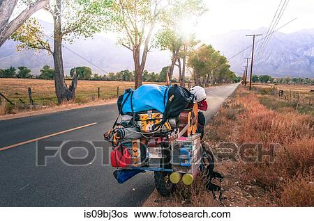 Loaded touring motorcycle parked on roadside, High Sierra National Forest, California, USA View Large Photo Image Stock Photograph - Loaded touring motorcycle parked on roadside, High Sierra National Forest, California, USA. Fotosearch