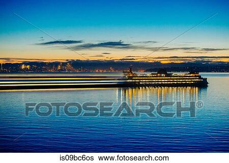 Stock Photograph - Long Exposure of ferry on Puget Sound at sunset, Bainbridge, Washington, United States. Fotosearch