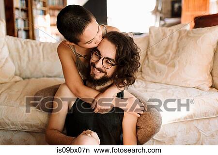 Loving couple relaxing on sofa View Large Photo Image Picture - Loving couple relaxing on sofa. Fotosearch