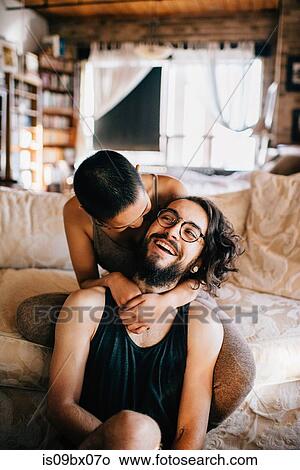 Loving couple relaxing on sofa View Large Photo Image Picture - Loving couple relaxing on sofa. Fotosearch