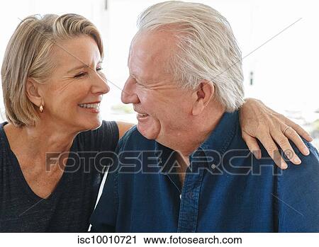 Loving senior couple talking at home View Large Photo Image Stock Image - Loving senior couple talking at home. Fotosearch