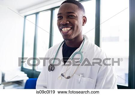 Stock Photo - Male doctor at hospital reception. Fotosearch