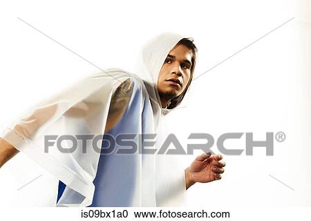 Stock Image - Male model wearing raincoat. Fotosearch
