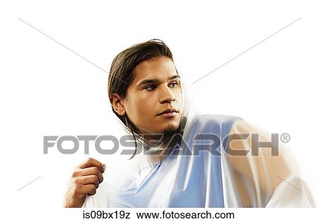 Male model wearing raincoat View Large Photo Image Stock Photo - Male model wearing raincoat. Fotosearch