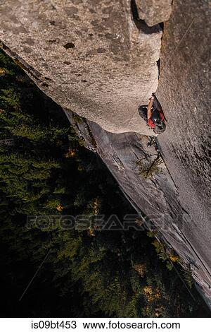 Male rock climber climbing rock face, overhead view, The Chief, Squamish, British Columbia, Canada View Large Photo Image Stock Image - Male rock climber climbing rock face, overhead view, The Chief, Squamish, British Columbia, Canada. Fotosearch