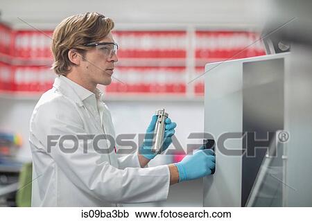 Male worker in thread factory, placing lab samples in chemical oven View Large Photo Image Stock Image - Male worker in thread factory, placing lab samples in chemical oven. Fotosearch