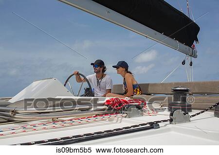 Man and woman on sailing boat, British Virgin Islands View Large Photo Image Stock Photography - Man and woman on sailing boat, British Virgin Islands. Fotosearch