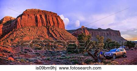 Man by off road vehicle, Indian Creek, Moab, Utah, USA View Large Photo Image Stock Image - Man by off road vehicle, Indian Creek, Moab, Utah, USA. Fotosearch