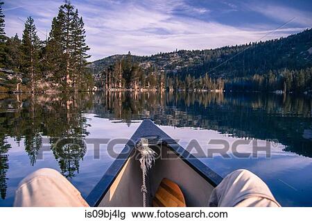 Man canoeing on Echo Lake, personal perspective, High Sierras, California, USA View Large Photo Image Stock Image - Man canoeing on Echo Lake, personal perspective, High Sierras, California, USA. Fotosearch
