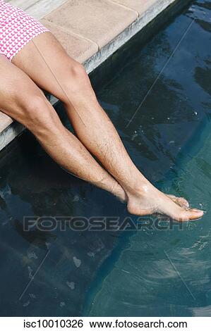 Man dipping feet in swimming pool View Large Photo Image Stock Photograph - Man dipping feet in swimming pool. Fotosearch