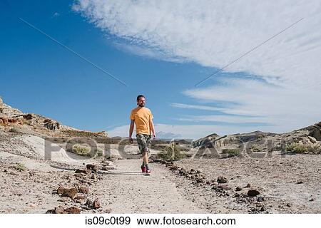 Man exploring nature reserve, Red Rock Canyon, Cantil, California, United States View Large Photo Image Stock Photo - Man exploring nature reserve, Red Rock Canyon, Cantil, California, United States. Fotosearch