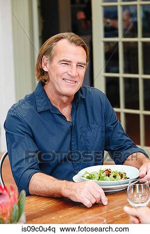 Man having lunch in restaurant, Cape Town, South Africa View Large Photo Image Stock Photography - Man having lunch in restaurant, Cape Town, South Africa. Fotosearch