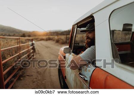 Man in off road vehicle on landscape of Kennedy Meadows, California, US View Large Photo Image Stock Photo - Man in off road vehicle on landscape of Kennedy Meadows, California, US. Fotosearch