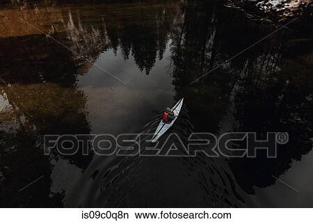Man kayaking in lake, Yosemite Village, California, United States View Large Photo Image Picture - Man kayaking in lake, Yosemite Village, California, United States. Fotosearch