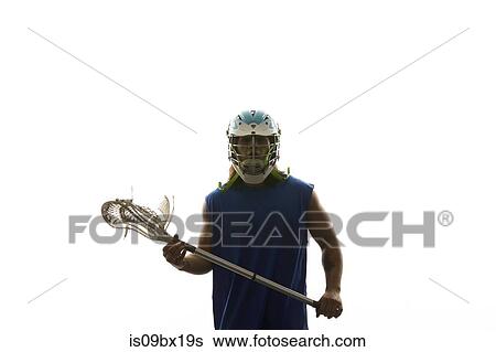 Man modelling lacrosse helmet and stick View Large Photo Image Stock Photograph - Man modelling lacrosse helmet and stick. Fotosearch