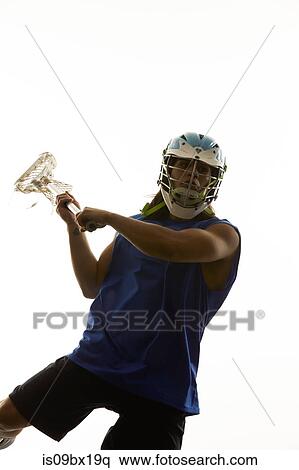Man modelling lacrosse helmet and stick View Large Photo Image Stock Photography - Man modelling lacrosse helmet and stick. Fotosearch