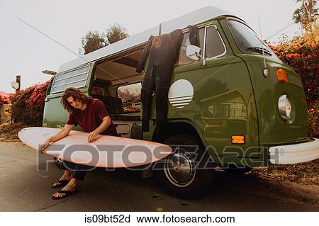 Man on van road trip with his surfboard, Ventura, California, US View Large Photo Image Stock Image - Man on van road trip with his surfboard, Ventura, California, US. Fotosearch
