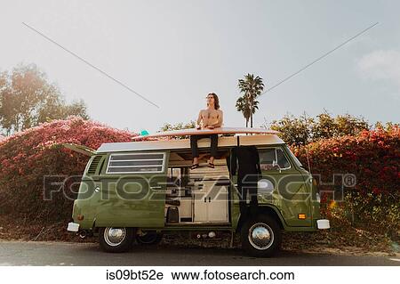Man on van road trip with his surfboard, Ventura, California, US View Large Photo Image Stock Image - Man on van road trip with his surfboard, Ventura, California, US. Fotosearch