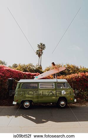 Man on van road trip with his surfboard, Ventura, California, US View Large Photo Image Stock Image - Man on van road trip with his surfboard, Ventura, California, US. Fotosearch