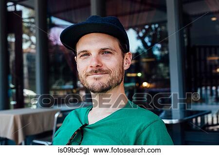 Stock Photograph - Man outside cafe, Long Beach, California, US. Fotosearch