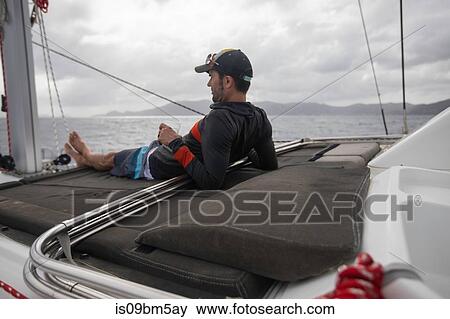 Man relaxing on sailing boat, British Virgin Islands View Large Photo Image Stock Photo - Man relaxing on sailing boat, British Virgin Islands. Fotosearch