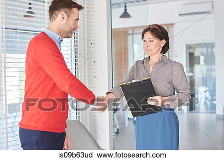 Man shaking hands at job interview View Large Photo Image Stock Image - Man shaking hands at job interview. Fotosearch