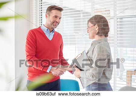 Man shaking hands at job interview View Large Photo Image Stock Image - Man shaking hands at job interview. Fotosearch
