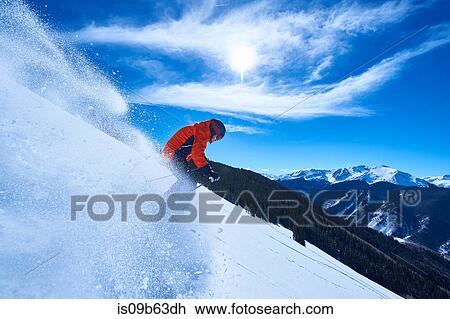 Man skiing down deep snow covered mountainside, Aspen, Colorado, USA View Large Photo Image Stock Image - Man skiing down deep snow covered mountainside, Aspen, Colorado, USA. Fotosearch
