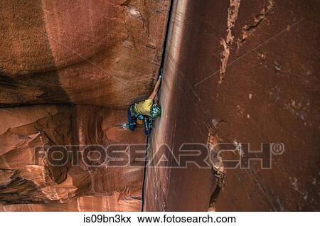 Man trad climbing, Indian Creek, Moab, Utah, USA View Large Photo Image Stock Photo - Man trad climbing, Indian Creek, Moab, Utah, USA. Fotosearch