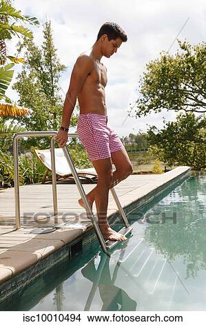 Man walking down steps into swimming pool View Large Photo Image Picture - Man walking down steps into swimming pool. Fotosearch