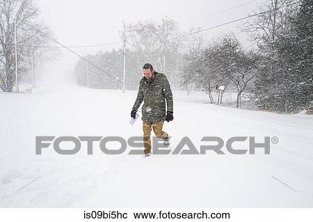 Man walking in blizzard, Bath, Canada View Large Photo Image Stock Image - Man walking in blizzard, Bath, Canada. Fotosearch