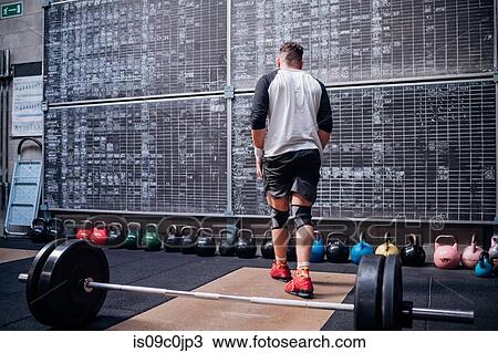 Man working out in gym View Large Photo Image Stock Image - Man working out in gym. Fotosearch
