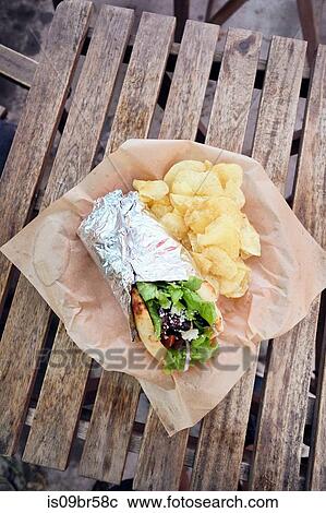 Meal of salad wrap and potato chips View Large Photo Image Stock Image - Meal of salad wrap and potato chips. Fotosearch