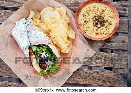 Meal of salad wrap, potato chips and dip View Large Photo Image Stock Photo - Meal of salad wrap, potato chips and dip. Fotosearch