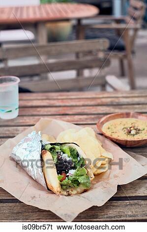 Meal of salad wrap, potato chips and dip View Large Photo Image Stock Photograph - Meal of salad wrap, potato chips and dip. Fotosearch